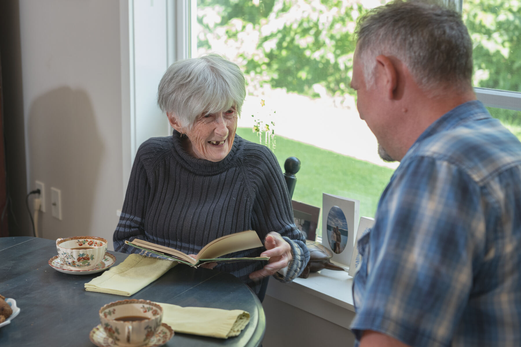 Companionship: a provider and client chatting over tea